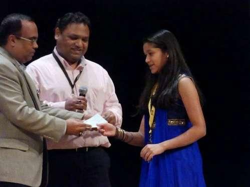 Interview with Isha Mohapatra - winner of the 2014 Samik Singh Kalinga Youth Entrepreneurship Competition (SSKYEC) (Isha receiving $1,000 check from Tapan Padhi (president of OSA) and Ranjan Dash)